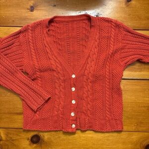 Red cable knit sweater